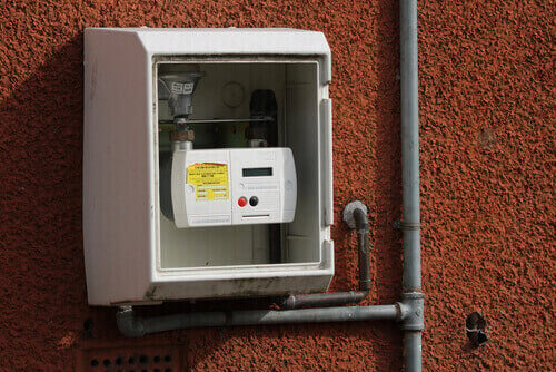 Prepayment gas meter outside on wall
