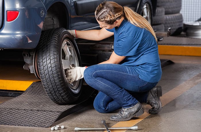 Mechanic servicing a car