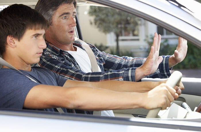Driving instructor teaching a learner driver