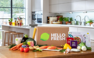Hello Fresh man in kitchen with box