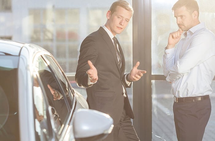Salesman selling a car