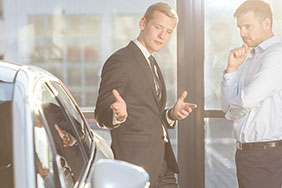 Salesman selling a car