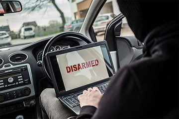 Thief trying to disarm car security