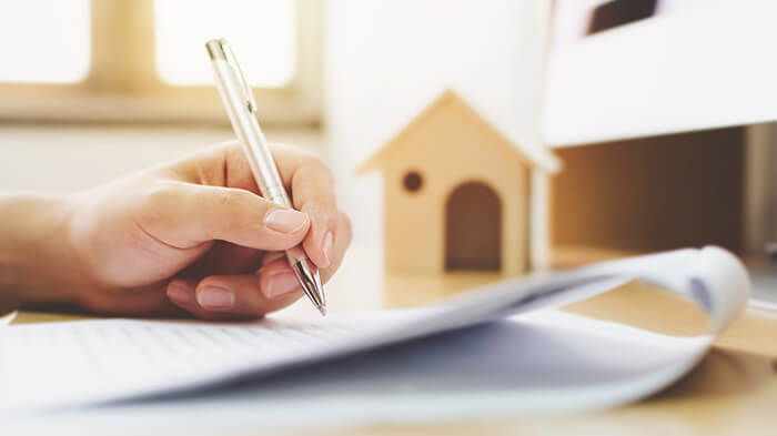 Person looking through a mortgage document