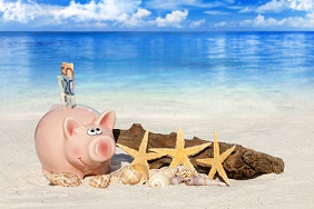 Piggy bank on a beach