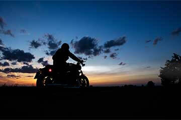 Motorbike rider on their motorcycle at dusk