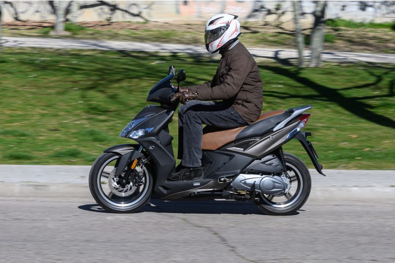Motorcyclist driving their 50cc moped