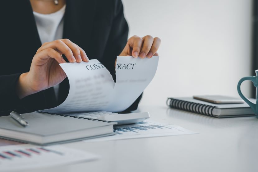 Woman tearing up a contract