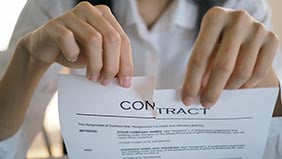 Woman tearing up a contract