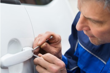 Locksmith getting into a car