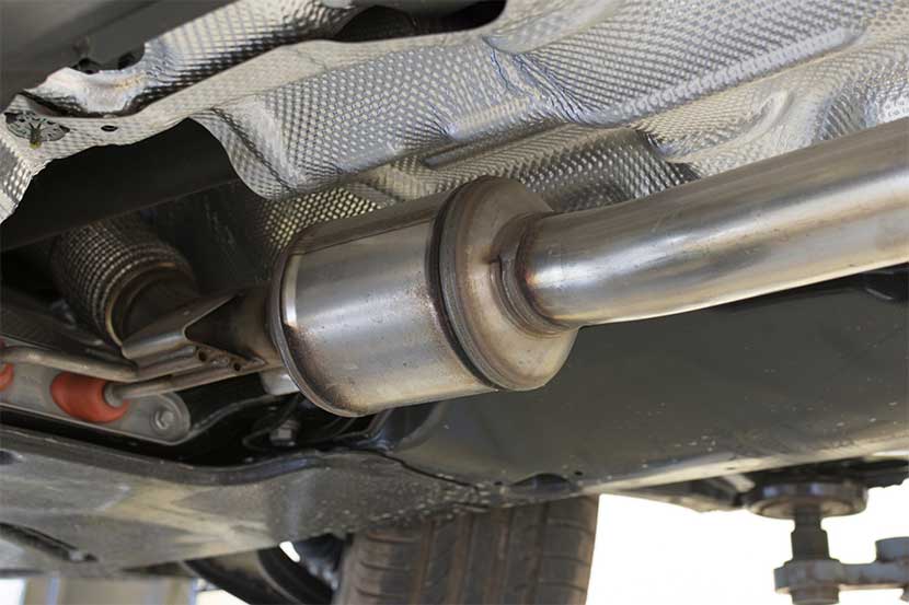 Catalytic converter under the body of a car