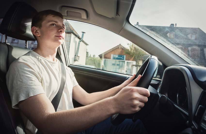 Young driver in a car