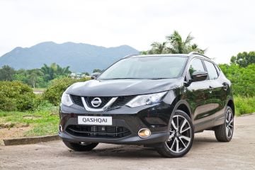 A black Nissan in the UK countryside 