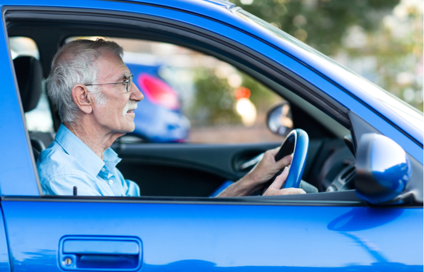 Elderly driver behind the wheel of their car