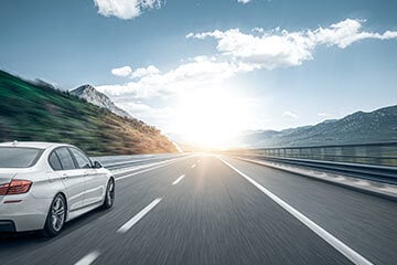 car driving on the left hand side of the road