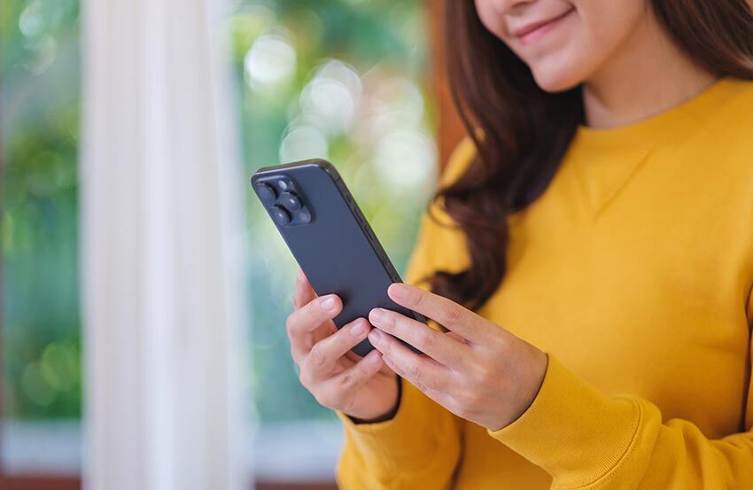 Female looking at her mobile phone