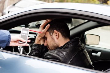 A driver is tested for drink driving