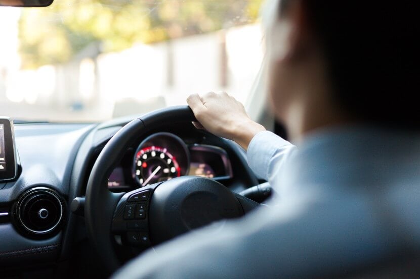 Person driving on a sunny day