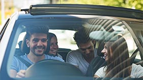 Friends sharing a car