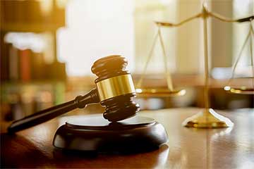 Gavel and scales at a court house