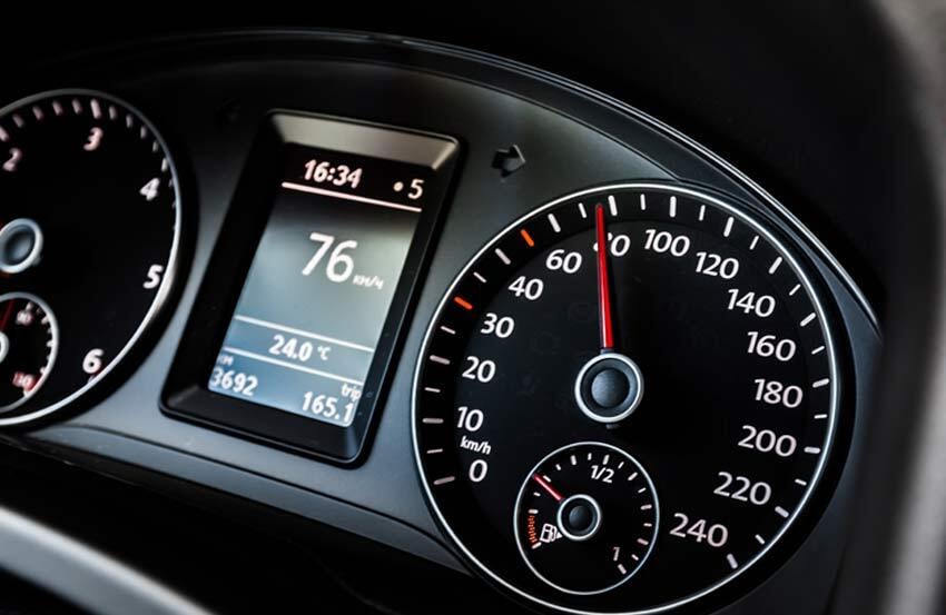 Dashboard of a car showing vehicle's mileage to be 3692 kilometers