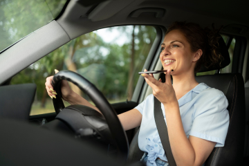 Woman using mobile while driving