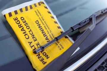 Image showing a yellow PCN ticket on a windscreen