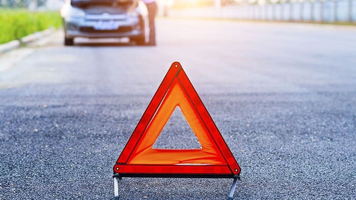 red warning triangle broken down car
