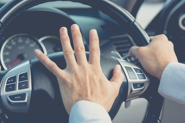 A driver beeps their horn in a display of road rage