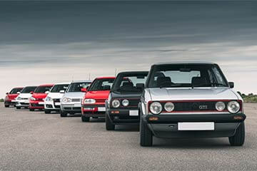 Line of Volkswagen Golfs showing various generations