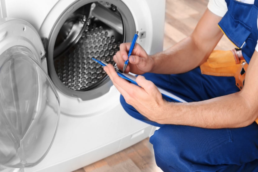 Man fixing a washing machine