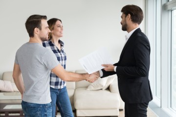 Tenants and a landlord shaking hands