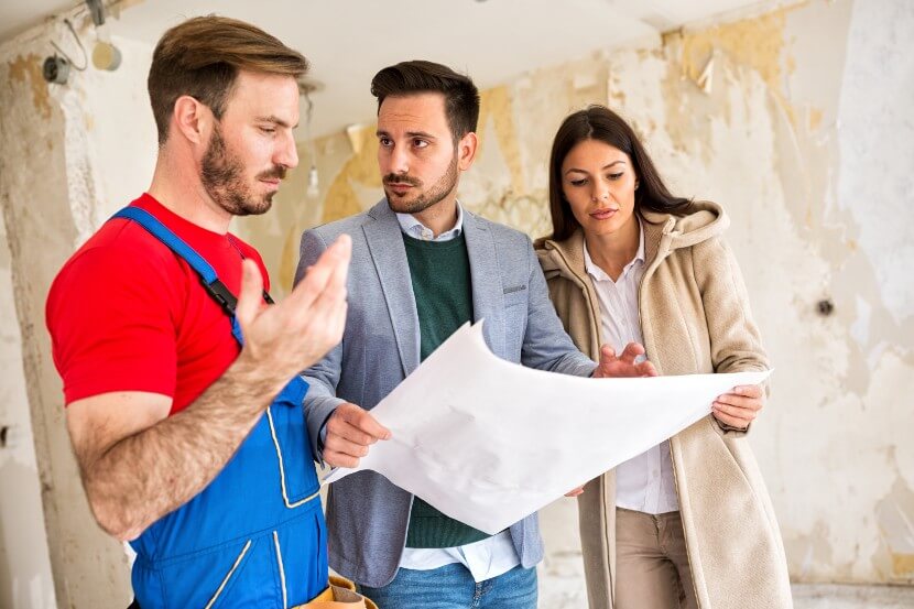 Couple complaining to a builder about poor workmanship