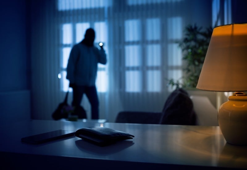 Burglar enters a home at night