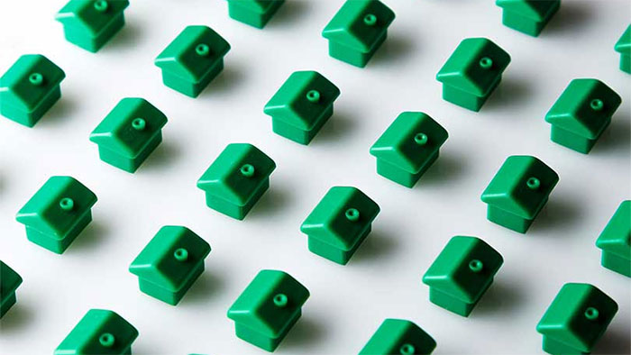 Row of green toy houses