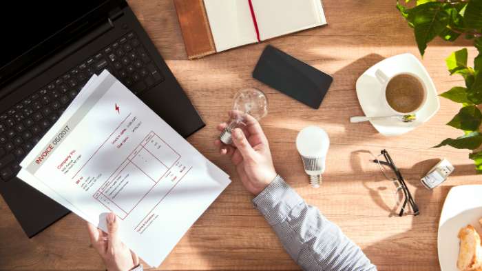 Man checking business energy bill