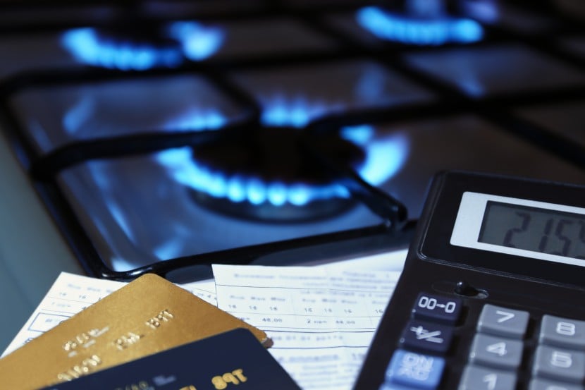 Gas hob with credit cards, bills and a calculator