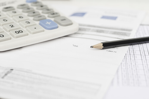Energy bill with pencil and calculator