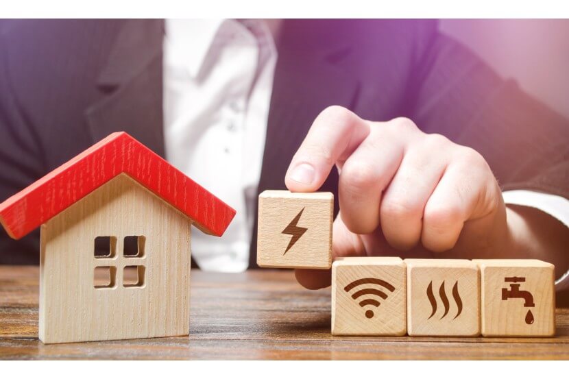Wooden blocks with a house and home utilities