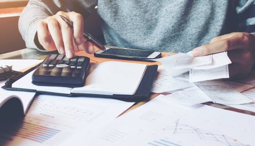 Man using calculator