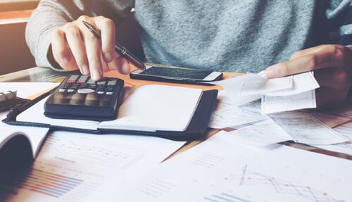 Man using calculator