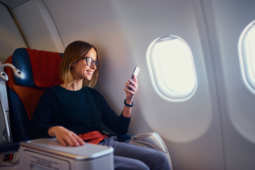 woman using phone on place