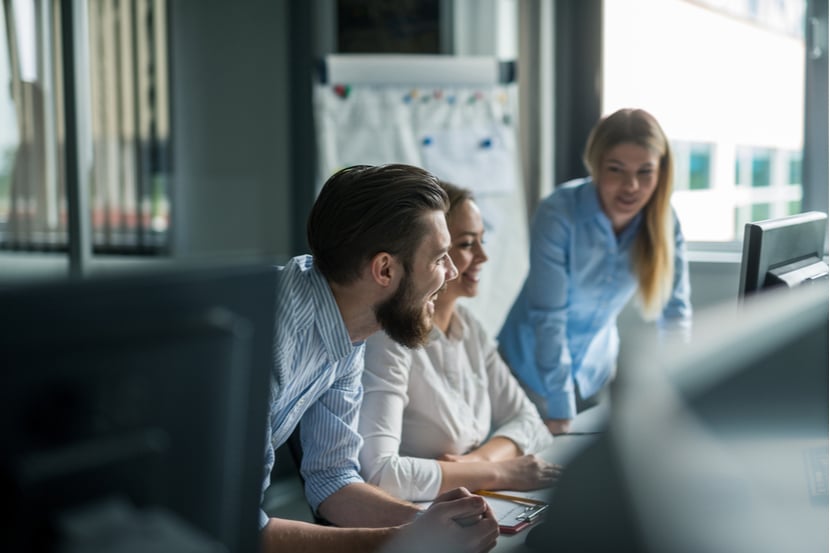 Work colleagues holding a team meeting