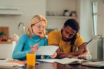 A couple working out increasing term life insurance