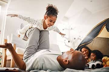 dad playing with his daughter