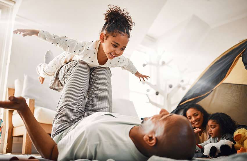 dad playing with his daughter