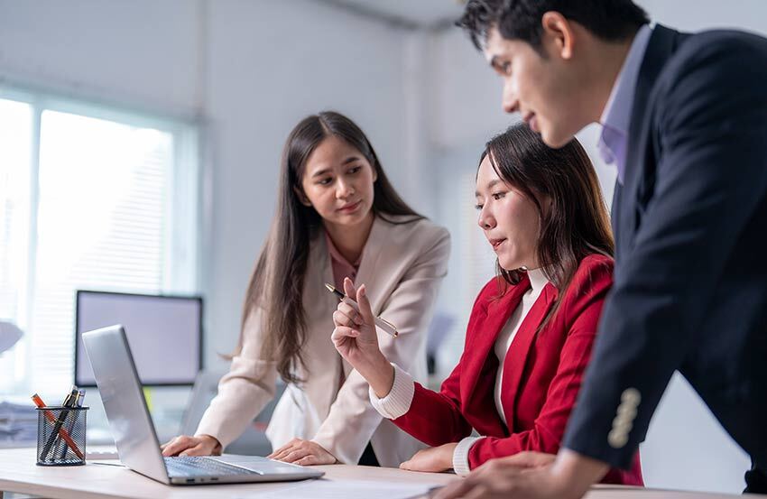 A business working together around a key person