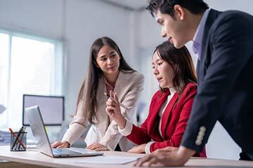 A business working together around a key person