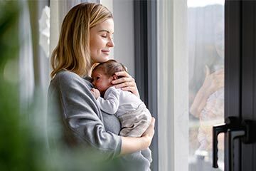A new mother holding her baby 