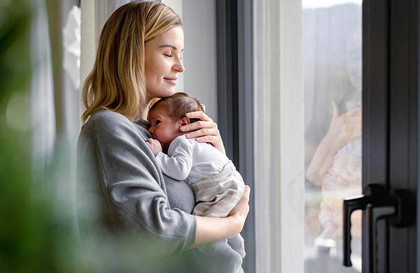 A new mother holding her baby
